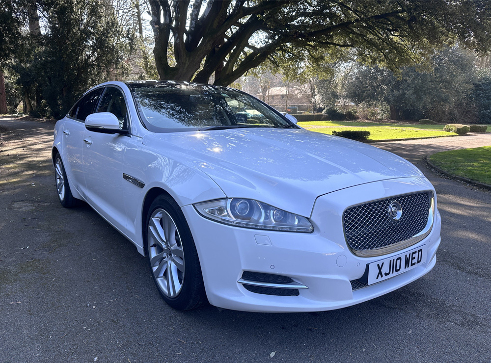 Jaguar XJ luxury saloon dressed with ribbon for a wedding